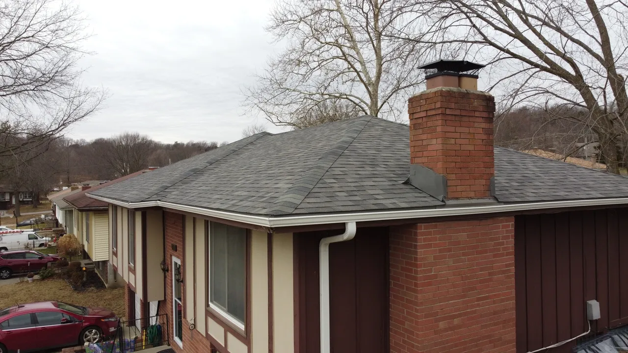 A house with a roof that has been covered in shingles.